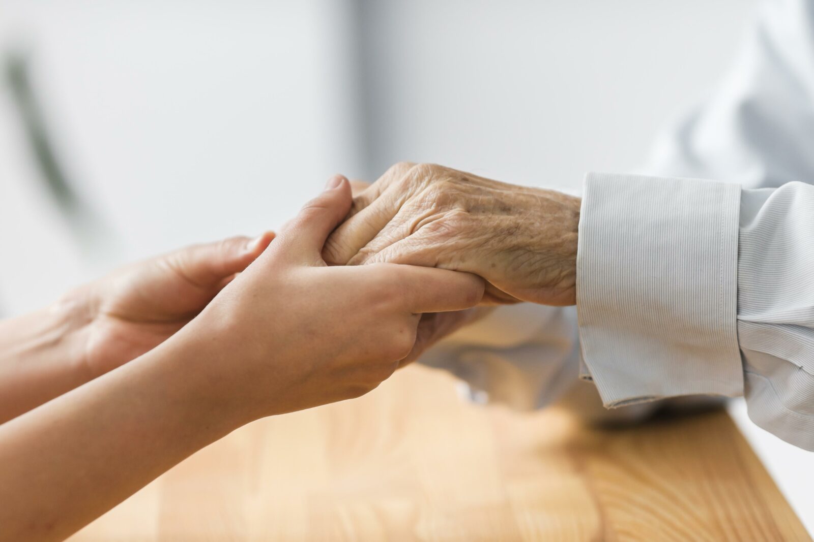 Nurse Holding Senior Man S Hands Comfort